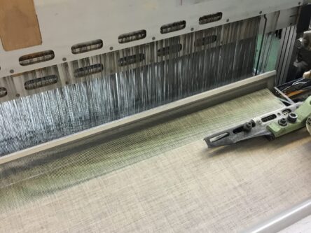 Fabric weaving in textile loom